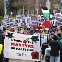 People hold signs as they protest the arrest of former Columbia University anti-Israel student activist Mahmoud Khalil during a 'Fight for Our Rights' demonstration at the University of Washington campus in Seattle, Washington, March 15, 2025. (Jason Redmond / AFP)