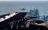 This grab from footage shared by the US Central Command on March 15, 2025 shows a US F/A-18 Super Hornet attack fighter jet taking off from the US Navy's USS Harry S. Truman aircraft carrier in the Red Sea  reportedly amidst operations launched against Houthis in Yemen (DVIDS / AFP)