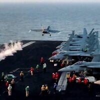This grab from footage shared by the US Central Command on March 15, 2025 shows a US F/A-18 Super Hornet attack fighter jet taking off from the US Navy's USS Harry S. Truman aircraft carrier in the Red Sea  reportedly amidst operations launched against Houthis in Yemen (DVIDS / AFP)