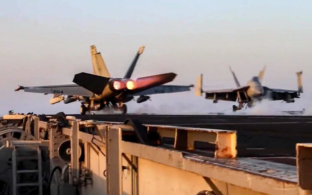 This grab from footage shared by the US Central Command (CENTCOM) on March 15, 2025, shows a US F/A-18 fighter aircraft taking off from an aircraft carrier at sea reportedly amidst operations launched against Houthis in Yemen. (DVIDS / AFP)