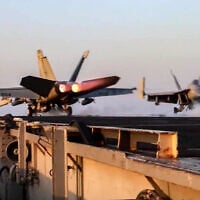 This grab from footage shared by the US Central Command (CENTCOM) on March 15, 2025, shows a US F/A-18 fighter aircraft taking off from an aircraft carrier at sea reportedly amidst operations launched against Houthis in Yemen. (DVIDS / AFP)