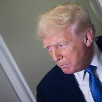 US President Donald Trump speaks to reporters aboard Air Force One while flying to Washington, DC, from Florida, on March 16, 2025, above Virginia. (Brendan Smialowski/AFP)