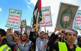Supporters of Yemen's Iran-backed Houthi rebels brandish rifles and chant during a demonstration against US airstrikes, in Sanaa, Yemen, March 17, 2025. (Mohammed Huwais / AFP)