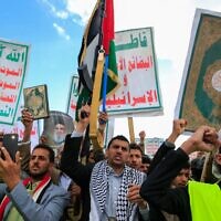 Supporters of Yemen's Iran-backed Houthi rebels brandish rifles and chant during a demonstration against US airstrikes, in Sanaa, Yemen, March 17, 2025. (Mohammed Huwais / AFP)