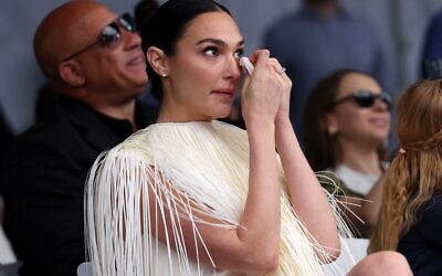 Israeli actress Gal Gadot wipes away a tear as she attends her Hollywood Walk of Fame Star Ceremony in front of El Capitan in Los Angeles, California, on March 18, 2025. (Photo by VALERIE MACON / AFP)