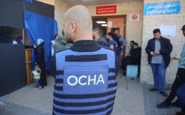 A UN staff member stands outside the Al-Aqsa Martyrs Hospital after transporting casualties from UN staff members, including foreigners, to the medical facility in Deir al-Balah in the central Gaza Strip on March 19, 2025. (Eyad BABA / AFP) A UN staff member stands outside the Al-Aqsa Martyrs Hospital after transporting casualties from UN staff members, including foreigners, to the medical facility in Deir al-Balah in the central Gaza Strip on March 19, 2025. (Eyad BABA / AFP)