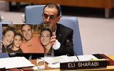 Released hostage Eli Sharabi holds up a photo of his family as he speaks at the UN Security Council in New York on March 20, 2025. Sharabi’s wife Lianne and their daughters, Noiya, 16, and Yahel, 13, were killed by terrorists in their home’s safe room at Kibbutz Be’eri on October 7, 2023 (Michael M. Santiago/Getty Images/AFP)