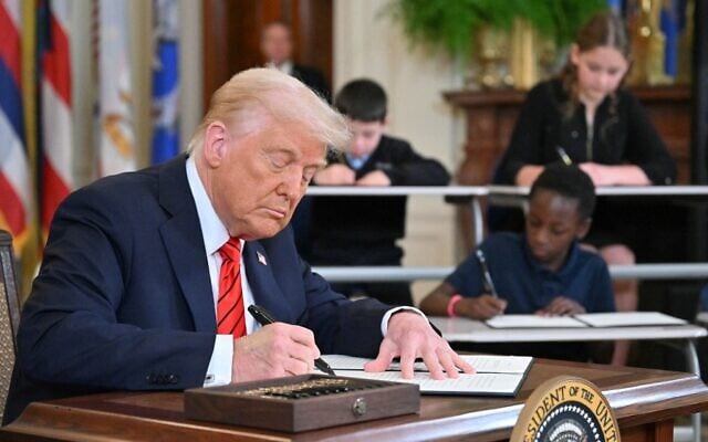US President Donald Trump signs an executive order aimed at shutting down the Education Department in the East Room of the White house in Washington, DC, on March 20, 2025. (Mandel NGAN / AFP) US President Donald Trump signs an executive order aimed at shutting down the Education Department in the East Room of the White house in Washington, DC, on March 20, 2025. (Mandel NGAN / AFP)