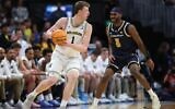 Danny Wolf #1 of the Michigan Wolverines drives against Justin Rochelin #5 of the UC San Diego Tritons during the second half in the first round of the NCAA Men's Basketball Tournament at Ball Arena on March 20, 2025 in Denver, Colorado. (Matthew Stockman/Getty Images/AFP)