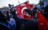 People gather outside Istanbul's city hall to support Istanbul mayor Ekrem Immamoglu following his arrest in connection with two probes, one for "aiding a terrorist organization" and a second for graft, in Istanbul, on March 22, 2025. (Kemal Aslan/AFP)
