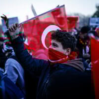 People gather outside Istanbul's city hall to support Istanbul mayor Ekrem Immamoglu following his arrest in connection with two probes, one for "aiding a terrorist organization" and a second for graft, in Istanbul, on March 22, 2025. (Kemal Aslan/AFP)