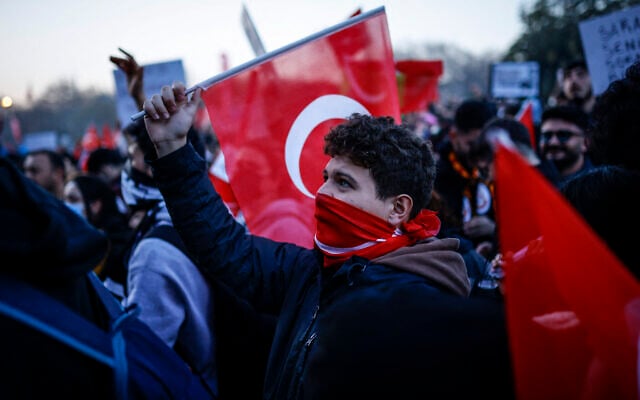 People gather outside Istanbul's city hall to support Istanbul mayor Ekrem Immamoglu following his arrest in connection with two probes, one for "aiding a terrorist organization" and a second for graft, in Istanbul, on March 22, 2025. (Kemal Aslan/AFP) People gather outside Istanbul's city hall to support Istanbul mayor Ekrem Immamoglu following his arrest in connection with two probes, one for "aiding a terrorist organization" and a second for graft, in Istanbul, on March 22, 2025. (Kemal Aslan/AFP)