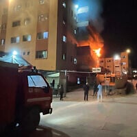 Palestinians try to put out a fire at the emergency department of the Nasser hospital after it was hit in an Israeli airstrike, in Khan Younis in the southern Gaza Strip on March 23, 2025. (AFP)