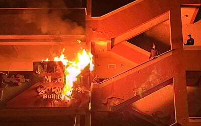 Palestinians try to put out a fire at the emergency department of the Nasser hospital after it was hit in an Israeli airstrike, in Khan Younis in the southern Gaza Strip on March 23, 2025. (AFP)