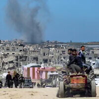 Smoke rises from Israeli shelling west of Beit Lahiya in the northern Gaza Strip on March 24, 2025. (BASHAR TALEB / AFP)
