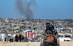 Smoke rises from Israeli shelling west of Beit Lahiya in the northern Gaza Strip on March 24, 2025. (BASHAR TALEB / AFP)