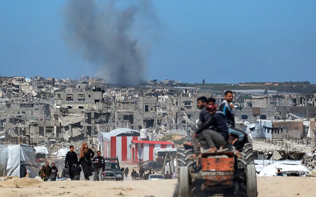 Smoke rises from Israeli shelling west of Beit Lahiya in the northern Gaza Strip on March 24, 2025. (BASHAR TALEB / AFP)