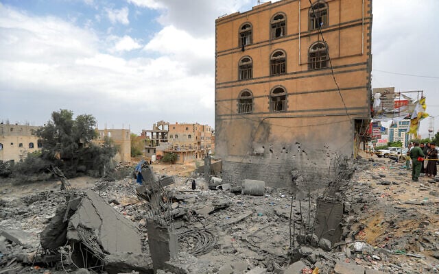 People gather by the rubble of a collapsed building at the site of a reported US air strike on Yemen's Houthi-held capital Sanaa on March 24, 2025 (Mohammed Huwais/AFP) People gather by the rubble of a collapsed building at the site of a reported US air strike on Yemen's Houthi-held capital Sanaa on March 24, 2025 (Mohammed Huwais/AFP)