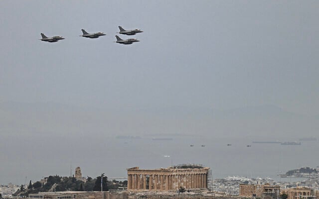 Hellenic Air Force Rafale jets fly over the Parthenon and the Acropolis during the military parade marking Greece's Independence Day in Athens on March 25, 2025. (Theophile Bloudanis / AFP) Hellenic Air Force Rafale jets fly over the Parthenon and the Acropolis during the military parade marking Greece's Independence Day in Athens on March 25, 2025. (Theophile Bloudanis / AFP)