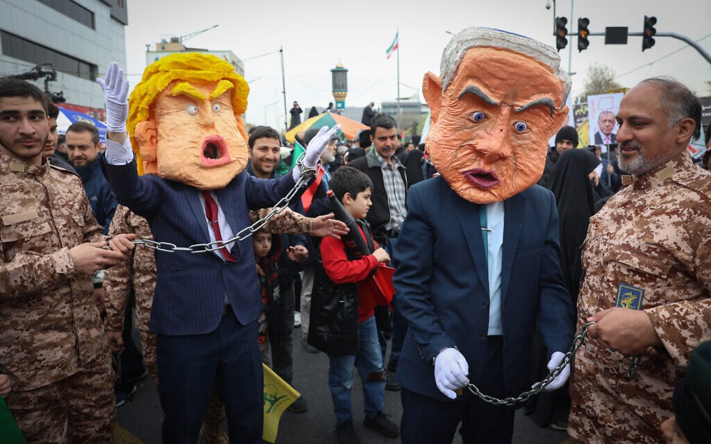Iranians hold effigies of Prime Minister Benjamin Netanyahu and US President Donald Trump during a Quds Day rally in Tehran, on March 28, 2025. (AFP)