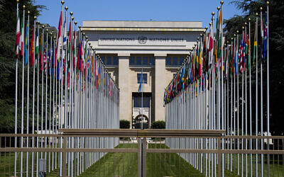 Flagpoles line in rows in front of a building of the United Nations in Geneva, Switzerland on June 14, 2021. (AP Photo/Markus Schreiber)