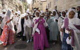 Orthodox Christians walk in the Good Friday procession in the Old City of Jerusalem, May 3, 2024. (AP Photo/Mahmoud Illean)