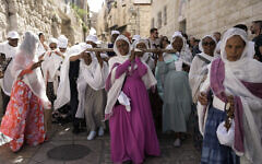 Orthodox Christians walk in the Good Friday procession in the Old City of Jerusalem, May 3, 2024. (AP Photo/Mahmoud Illean)