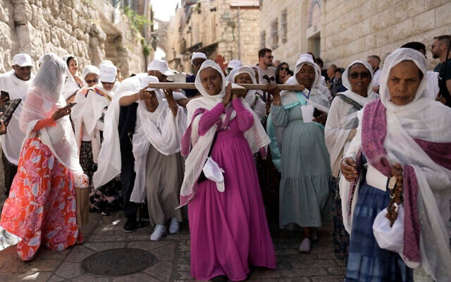 Orthodox Christians walk in the Good Friday procession in the Old City of Jerusalem, May 3, 2024. (AP Photo/Mahmoud Illean)
