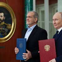 Russian President Vladimir Putin, right, and Iranian President Masoud Pezeshkian attend a signing ceremony for a partnership treaty to deepen their ties after their talks at the Kremlin in Moscow, Russia, Jan. 17, 2025. (Vyacheslav Prokofyev, Sputnik, Kremlin Pool Photo via AP)
