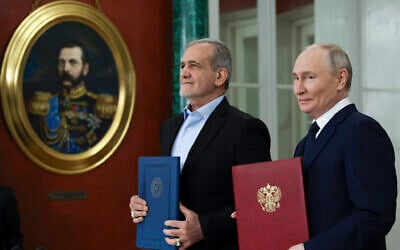 Russian President Vladimir Putin, right, and Iranian President Masoud Pezeshkian attend a signing ceremony for a partnership treaty to deepen their ties after their talks at the Kremlin in Moscow, Russia, Jan. 17, 2025. (Vyacheslav Prokofyev, Sputnik, Kremlin Pool Photo via AP)