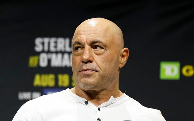 FILE - Joe Rogan looks on at the ceremonial weigh-in for the UFC 292 mixed martial arts event, August 18, 2023, in Boston. (AP Photo/Gregory Payan, File) FILE - Joe Rogan looks on at the ceremonial weigh-in for the UFC 292 mixed martial arts event, August 18, 2023, in Boston. (AP Photo/Gregory Payan, File)