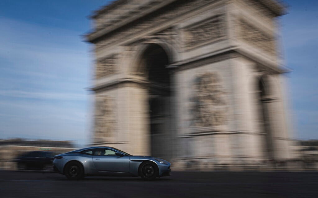 A sports car drives along the Place de l'Etoile, in front of the Arc de Triomphe, in Paris, France, February 18, 2025. (AP/Aurelien Morissard) A sports car drives along the Place de l'Etoile, in front of the Arc de Triomphe, in Paris, France, February 18, 2025. (AP/Aurelien Morissard)