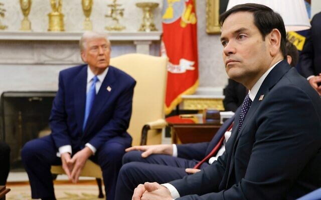 US Secretary of State Marco Rubio, right, listens as US President Donald Trump, left, meets with France's President Emmanuel Macron (not in picture) at the Oval Office of the White House, in Washington, February 24, 2025. (Ludovic Marin/Pool via AP)