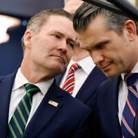 White House national security adviser Mike Waltz, left, speaks with Secretary of Defense Pete Hegseth in the Oval Office of the White House in Washington, Feb. 24, 2025. (Ludovic Marin/Pool via AP)
