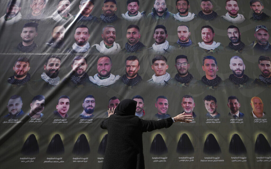 A woman reacts next to pictures of Hezbollah fighters at a mass funeral in southern Lebanon on Feb. 28, 2025. (AP/Hassan Ammar) A woman reacts next to pictures of Hezbollah fighters at a mass funeral in southern Lebanon on Feb. 28, 2025. (AP/Hassan Ammar)