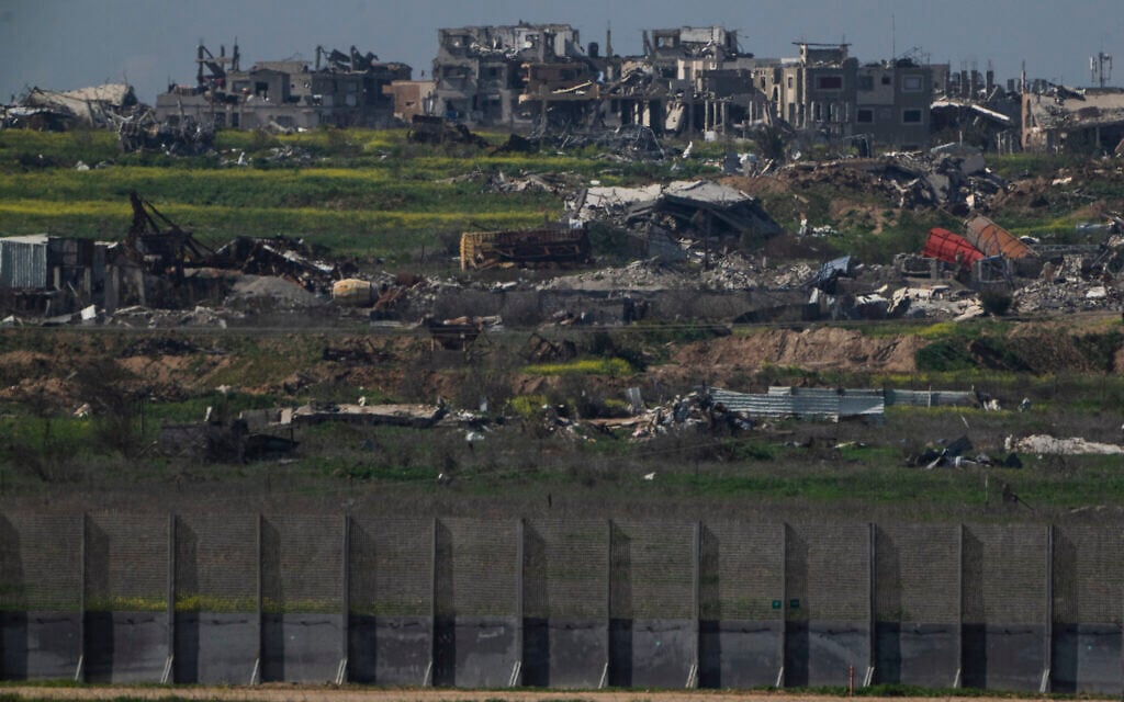 Destroyed buildings stand in the Gaza Strip as seen from southern Israel, Sunday, March 2, 2025. (AP Photo/Leo Correa)