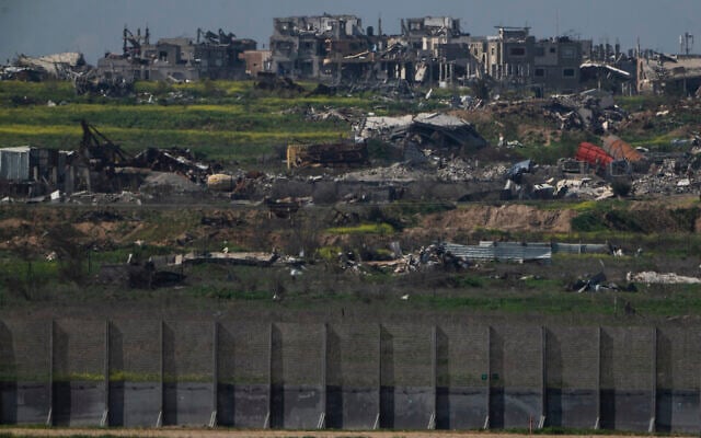 Destroyed buildings stand in the Gaza Strip as seen from southern Israel, Sunday, March 2, 2025. (AP Photo/Leo Correa)