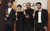 (From left) Basel Adra, Rachel Szor, Hamdan Ballal, and Yuval Abraham, winners of best documentary feature film award for 'No Other Land,' at the Oscars on March 2, 2025, at the Dolby Theatre in Los Angeles. (Jordan Strauss/Invision/AP)