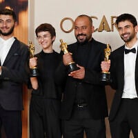 Basel Adra, from left, Rachel Szor, Hamdan Ballal, and Yuval Abraham, winners of best documentary feature film award for "No Other Land," at the Oscars on Sunday, March 2, 2025, at the Dolby Theatre in Los Angeles. (Jordan Strauss/Invision/AP)