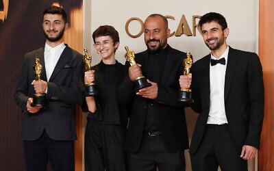 (From left) Basel Adra, Rachel Szor, Hamdan Ballal, and Yuval Abraham, winners of best documentary feature film award for 'No Other Land,' at the Oscars on March 2, 2025, at the Dolby Theatre in Los Angeles. (Jordan Strauss/Invision/AP)