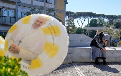 A nun prays outside the Agostino Gemelli Polyclinic where Pope Francis is hospitalized in Rome, Monday, March 3, 2025. (AP/Gregorio Borgia)