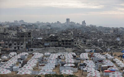 A tent camp for displaced Palestinians is set up amid destroyed buildings in the west of Al-Shati camp, west of Gaza City, on Monday, March 3, 2025. (AP Photo/Jehad Alshrafi)