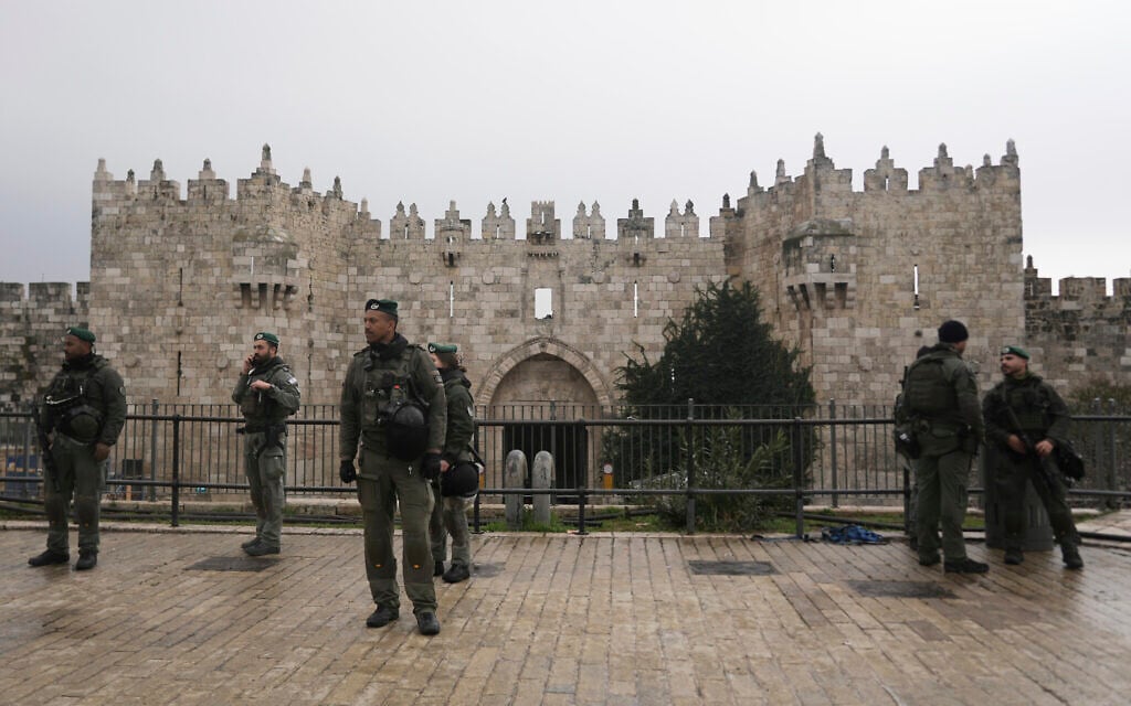 Israeli Border Police stand guard at the Damascus Gate to the Old City of Jerusalem as worshippers make their way to the Al-Aqsa Mosque compound for the first Friday Prayers of the Muslim holy month of Ramadan, March 7, 2025. (AP Photo/Mahmoud Illean)