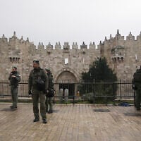 Israeli Border Police stand guard at the Damascus Gate to the Old City of Jerusalem as worshippers make their way to the Al-Aqsa Mosque compound for the first Friday Prayers of the Muslim holy month of Ramadan, March 7, 2025. (AP Photo/Mahmoud Illean)
