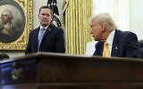 White House National Security Adviser Mike Waltz, left, listens as US President Donald Trump speaks in the Oval Office of the White House in Washington, March 7, 2025. (Pool via AP)