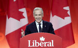 Canadian Liberal party leader Mark Carney smiles as he delivers his victory speech during the Liberal leadership announcement in Ottawa, Ontario, Sunday, March 9, 2025. (Adrian Wyld/The Canadian Press via AP)