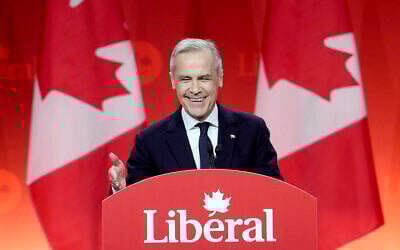 Canadian Liberal party leader Mark Carney smiles as he delivers his victory speech during the Liberal leadership announcement in Ottawa, Ontario, Sunday, March 9, 2025. (Adrian Wyld/The Canadian Press via AP)