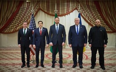This photo provided by the Ukrainian Presidential Press Office shows starting from left, US National Security Advisor Mike Waltz, US Secretary of State Marco Rubio, Ukrainian Head of Presidential Office Andriy Yermak, Ukrainian Foreign Minister Andrii Sybiha, and Ukrainian Minister of Defense Rustem Umerov pose for a photo after meeting in Jeddah, Saudi Arabia, March 11, 2025. (Ukrainian Presidential Press Office via AP)