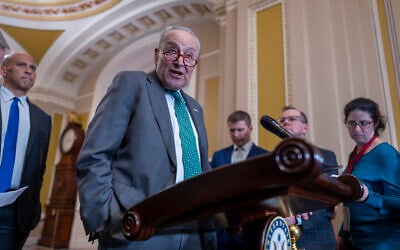 Senate Minority Leader Chuck Schumer, Democrat of New York, speaks with reporters as Republicans work to pass an interim spending bill that would avoid a partial government shutdown and keep federal agencies funded through September, at the Capitol in Washington, March 11, 2025. (J. Scott Applewhite/AP)