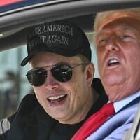 US President Donald Trump, right, and Tesla CEO Elon Musk speak to reporters as they sit in a Tesla vehicle on the South Lawn of the White House in Washigton, March 11, 2025. (Pool via AP)